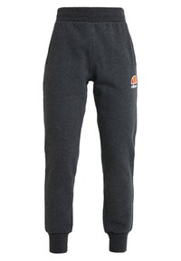 Mörkgrå träningsbyxor tillverkade av mjukt tyg, med elastisk midja, mudd i anklarna och en liten färgglad logotyp på vänster lår.