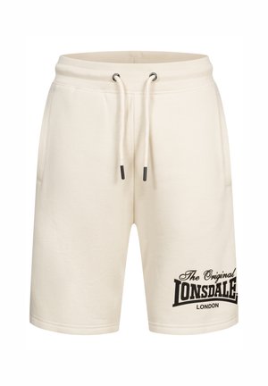 Beige bomuldsblandede shorts med elastisk talje og snor. Har sort brandingtekst på venstre ben og sidelommer.