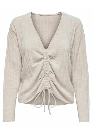 Haut à manches longues beige clair avec un col en V, présentant un design à côtes texturées et des détails froncés au centre avec des cordons de serrage.