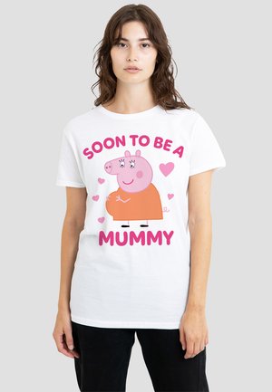 White cotton t-shirt featuring a cartoon pig in an orange outfit with the text "SOON TO BE A MUMMY" in pink. Simple, playful design.
