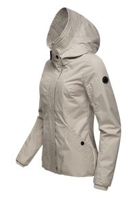 Beige hooded jacket made from smooth fabric, featuring a zippered front, side pockets with diamond pattern, and ribbed cuffs.