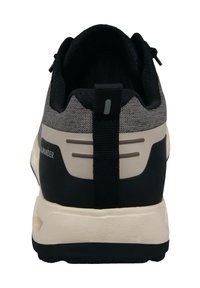 Black and gray athletic shoe with mesh upper, pull tab at rear, and rubber sole. Features subtle branding and reinforced heel design.
