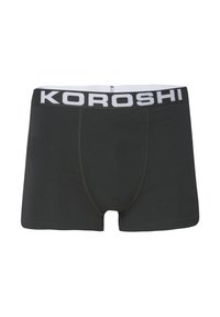 Črne bokserice iz mehkega materiala z širokim belim pasom, na katerem je napis "KOROSHI" v črni barvi. Vidne podrobnosti flatlock šivanja.