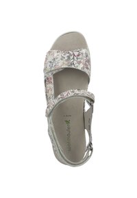 Vit sandal med blommönster i röd, blå och guld. Har två remmar och ett spänne bak. Mjuk, texturerad sula med varumärke.