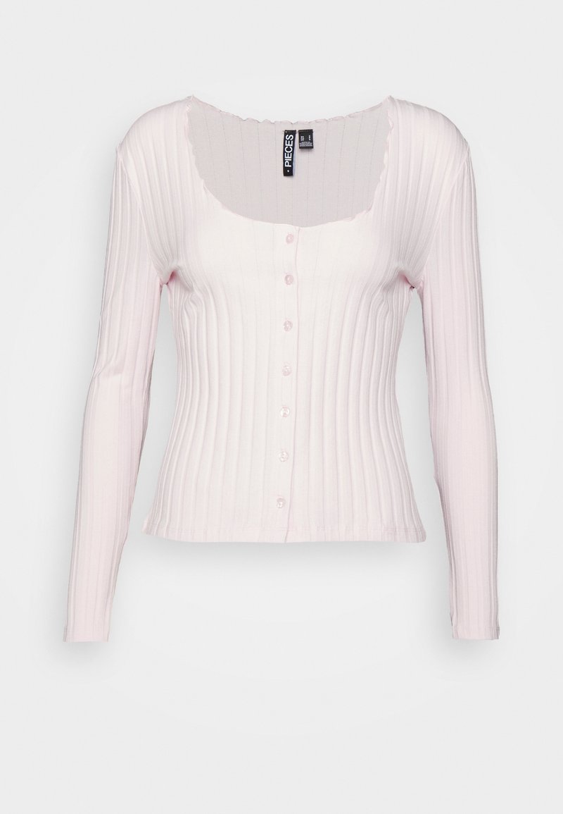 Light pink ribbed long-sleeve top with a scoop neckline, buttoned front, and fitted shape. Features a soft, textured fabric.