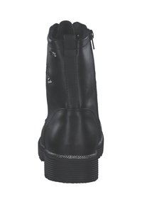 Bottine en cuir noir avec une fermeture éclair, bout rond, semelle texturée et accents scintillants sur le talon. Surface lisse.