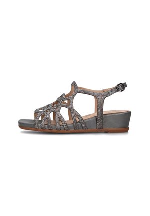 Sandali wedge grigi con punte aperte, caratterizzati da un design con cinturini decorati con accenti metallici e chiusura a fibbia. Suola liscia.