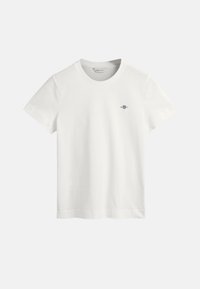 Witte katoenen t-shirt met een ronde hals, korte mouwen en een klein paars logo op de linkerkant van de borst. Glad materiaal, standaard pasvorm.