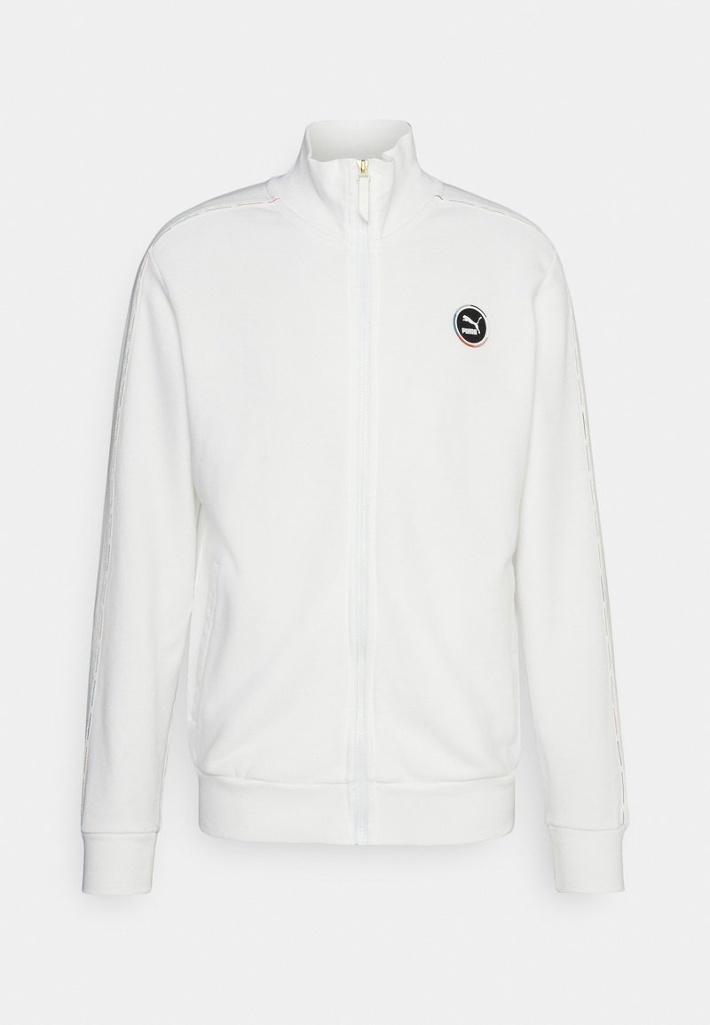 Sweatshirt zippé blanc en polaire, avec un col haut, des poignets côtelés et un logo rond sur la poitrine. Détails subtils à motifs sur les manches.