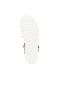 Sneaker sole with textured white rubber, featuring wavy pattern and branding. Side shows tan and light blue accents. Flat, rounded shape.