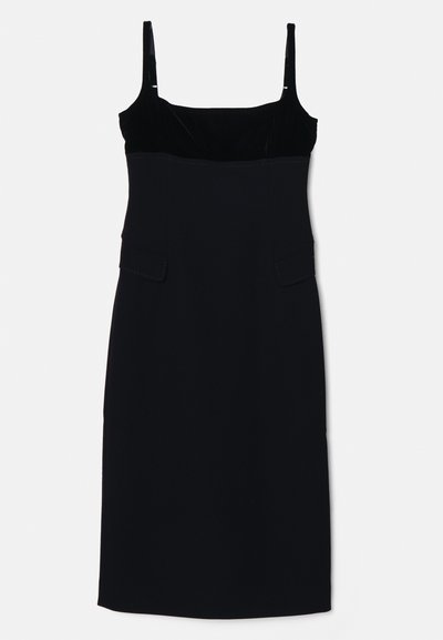 Μαύρο χωρίς μανίκια φόρεμα με βελούδινο κορμό και εφαρμοστή γραμμή, διαθέτει δύο τσέπες. Λείος υφάνσεις και ίσια μπάσες για μια κομψή σιλουέτα.