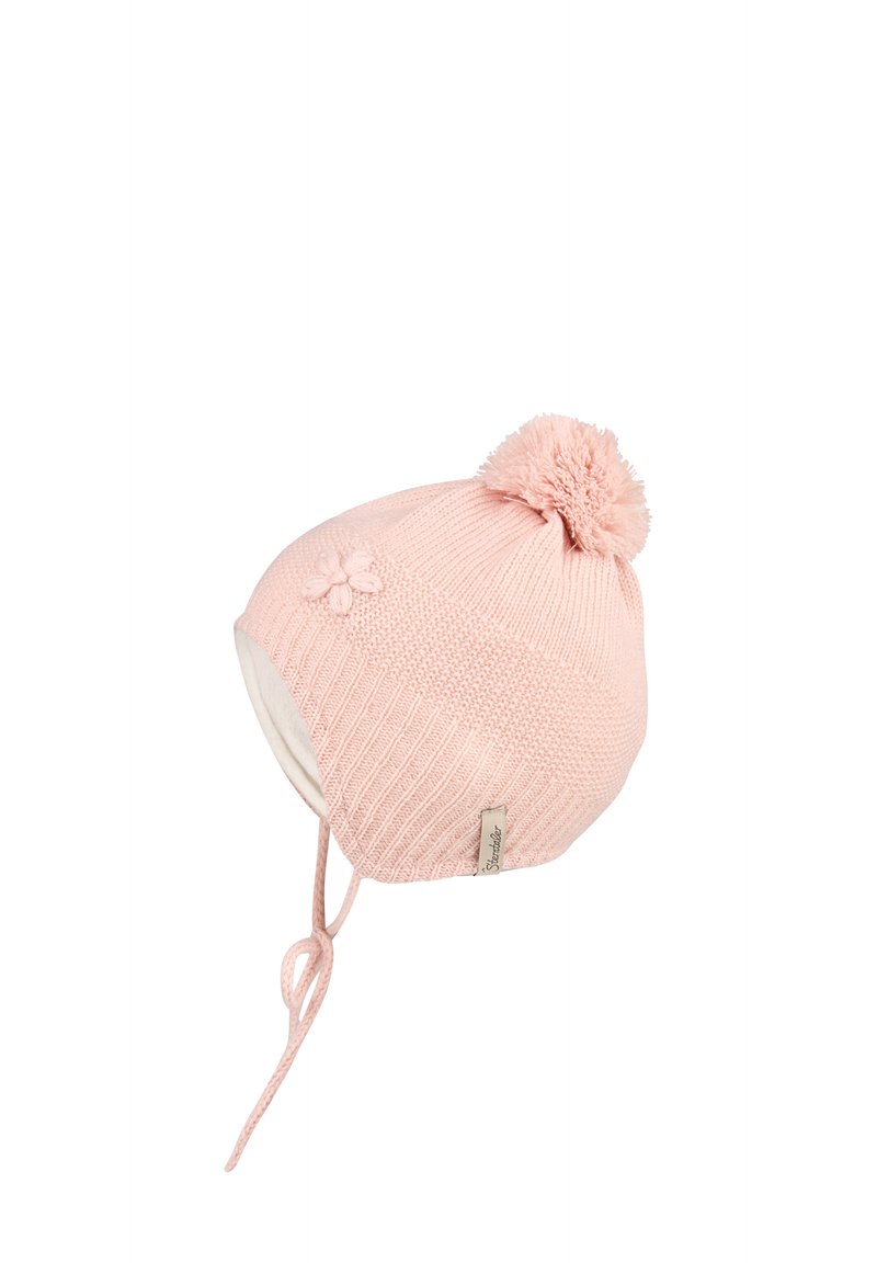 Pink knitted baby hat with pom-pom, earflaps, tie strings, and a small flower detail on the side.