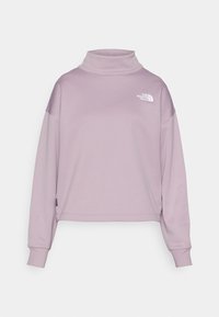 Lila sweatshirt med hög halsringning, långa ärmar och cropped passform. Har en vit logotyp på bröstet. Slät, mjuk textur.