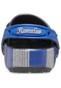 Blue and black clogs with a textured surface, featuring a prominent "Ravenclaw" logo and striped pattern on the sides in blue, gray, and white.