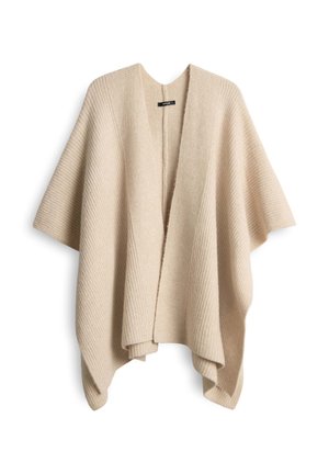Beige open-front poncho met ribbeltextuur, brede mouwen en een ontspannen silhouet. De stof lijkt zacht en lichtgewicht. Geen sluitingen zichtbaar.