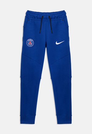 Μπλε αθλητικές φόρμες με το λογότυπο της Nike στο δεξί μηρό και το έμβλημα του συλλόγου Paris Saint-Germain στο αριστερό μηρό, με κορδόνι στη μέση και πλαϊνές τσέπες.