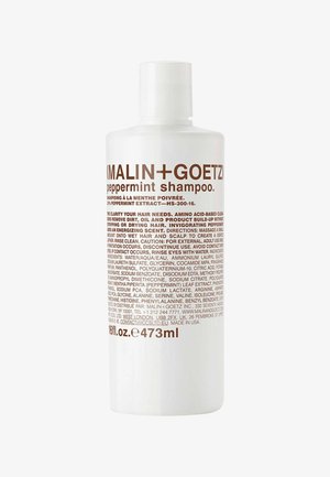 Malin + Goetz Pfefferminz-Shampoo-Flasche, weiß mit braunem Text, 473 ml, listet Inhaltsstoffe und Gebrauchsanweisungen auf dem Etikett auf.