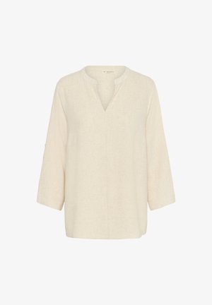 Bež linane särk, millel on nidus krae, kolmandiku pikkusega varrukad ja vaba lõige. Tekstuuriga materjal, millel on peen terade muster.