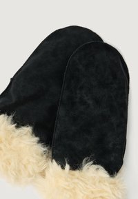 Black suede mittens with a soft, light beige fur trim along the wrist. The mittens have rounded tops and visible stitching details.