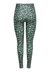 Πράσινο κολάν με μαύρο σχέδιο λεοπάρδαλης, ψηλή μέση, χωρίς ραφές και ελαστικό ύφασμα για άνεση και ευκινησία.