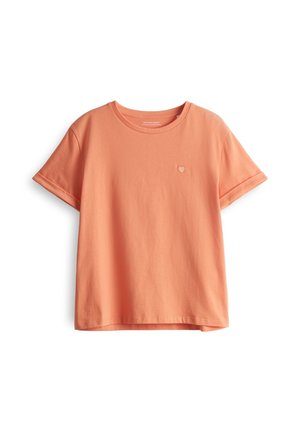 Kurzes T-Shirt mit Rundhalsausschnitt aus Korallenbaumwolle, mit einem kleinen gestickten Herz auf der linken Brust und umgeschlagenen Ärmeln.