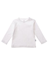 White long-sleeve shirt made from soft cotton. Features a round neckline with two snap buttons on one shoulder for easy dressing.