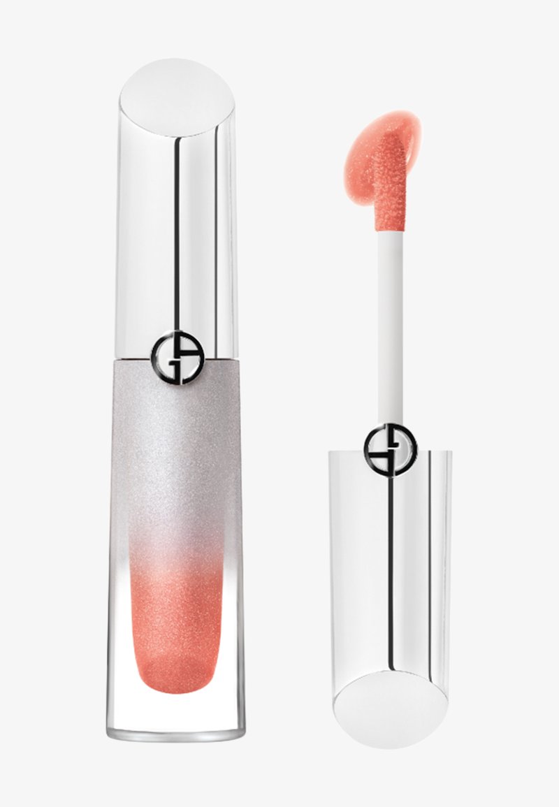 Lipgloss met doorzichtige en zilveren tube met koraalroze kleur, getoond gesloten met applicator ernaast.