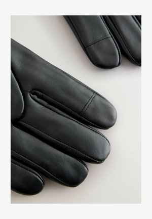 Schwarze Lederhandschuhe mit glatter Textur, schlankem Design und ausgeprägten Nähten entlang der Finger, die an jedem Finger eine leicht abgerundete Spitze aufweisen.