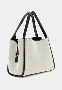 White mesh handbag with black leather accents and handles. Features a zipper closure and structured shape, suitable for daily use.