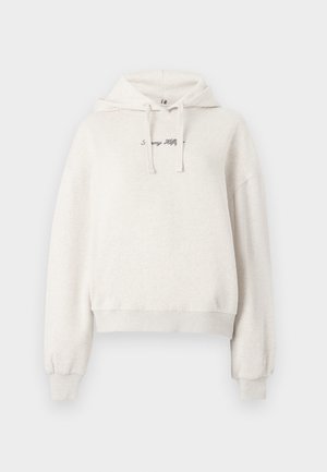 Jasny beżowy skrócony hoodie z kapturem na sznurek, żebrowanymi mankietami i dołem. Posiada haftowany tekst na klatce piersiowej. Miękka faktura materiału.