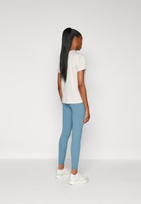 New Balance HARMONY HIGH RISE LEGGING - Pajkice - terrarium