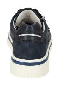 Navy suede shoe with a smooth texture, white rubber sole, and reflective accents on the heel. Features minimalistic design elements.