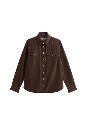 Brown denim shirt featuring a button-down front, two chest pockets, a pointed collar, and long sleeves with buttoned cuffs.