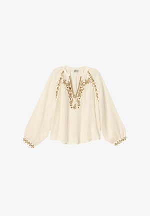 Blouse crème avec un décolleté en V, motifs floraux brodés marron et manches froncées. Présente des accents décoratifs aux poignets.