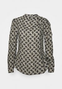 Chemisier à manches longues en beige clair avec un motif de feuilles noires, encolure ronde et détails froncés aux épaules. Texture lisse et ourlet incurvé.