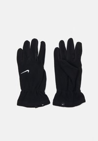 Sorte fleecehandsker med en tætsiddende pasform, der har et hvidt Nike-logo. Designet inkluderer elastiske manchetter for varme og komfort.
