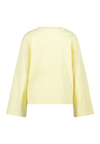 Yellow long-sleeve top made of soft cotton. Features a wide, cropped design with a crew neck and dropped shoulders. Smooth texture.