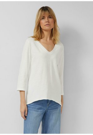 - Bluzka z długim rękawem