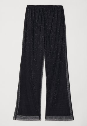Schwarze weit geschnittene Hose aus strukturiertem Gewebe, mit einer transparenten Schicht und reflektierenden Punkten sowie einem elastischen Bund für Komfort.