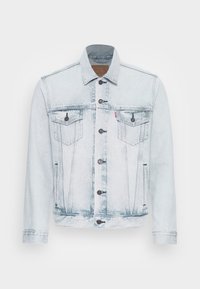 Vaaleansininen denim-takki klassisella leikkauksella, jossa on kaksinkertaiset rintataskut, napitus edessä ja haalistuneet yksityiskohdat.