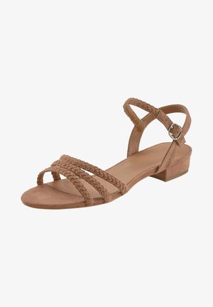 Brown suede sandal featuring braided straps, an open toe, and a low block heel with an adjustable ankle strap and metal buckle.