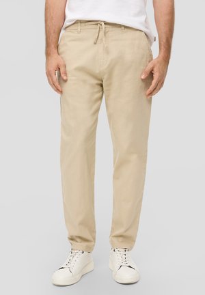 - Spodnie materiałowe