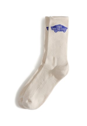 Flødefarvede bomuldssokker med ribbet tekstur og en blå "Off the Wall" logo. Har rundet tå og forstærket hældesign.