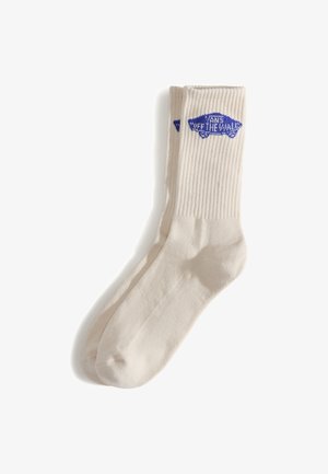 Baumwollsocken in Cremeton mit geripptem Muster und blauem "Off the Wall"-Logo. Sie verfügen über eine abgerundete Zehenpartie und ein verstärktes Fersendesign.