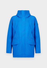 Blue jacket featuring a high collar, two large front pockets, and a sleek, minimalist design with distinct seam details.