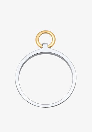 Hõbedane ümmargune võtmehoidja, millel on sile pind, ja millel on kuldne ümmargune klamber. Sujuv disain, minimalistlik kontrastsete värvidega.