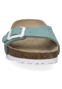 Infradito stile Birkenstock in pelle verde menta con fibbia bianca, soletta in sughero e suola in gomma bianca testurizzata per una migliore presa.
