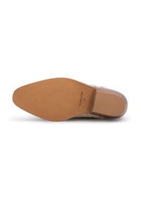 Beige schoenenzool met een gestructureerd lichtbruine rubberen oppervlakte, voorzien van een kleine hak en duidelijke reliëf logo-details.