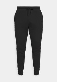 Schwarze Jogginghose mit schmal zulaufendem Schnitt, Kordelzugbund und gerippten Bündchen. Glatte Textur mit minimaler detaillierung und ohne sichtbare Muster.
