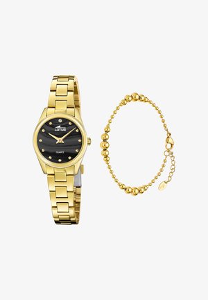 Reloj de cuarzo tono dorado con esfera negra texturizada, acentuada por puntos dorados. Incluye una pulsera de cuentas doradas a juego. Ambos tienen un acabado pulido.